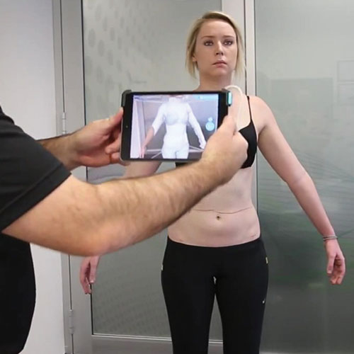 posture-scanning woman getting her posture scanned